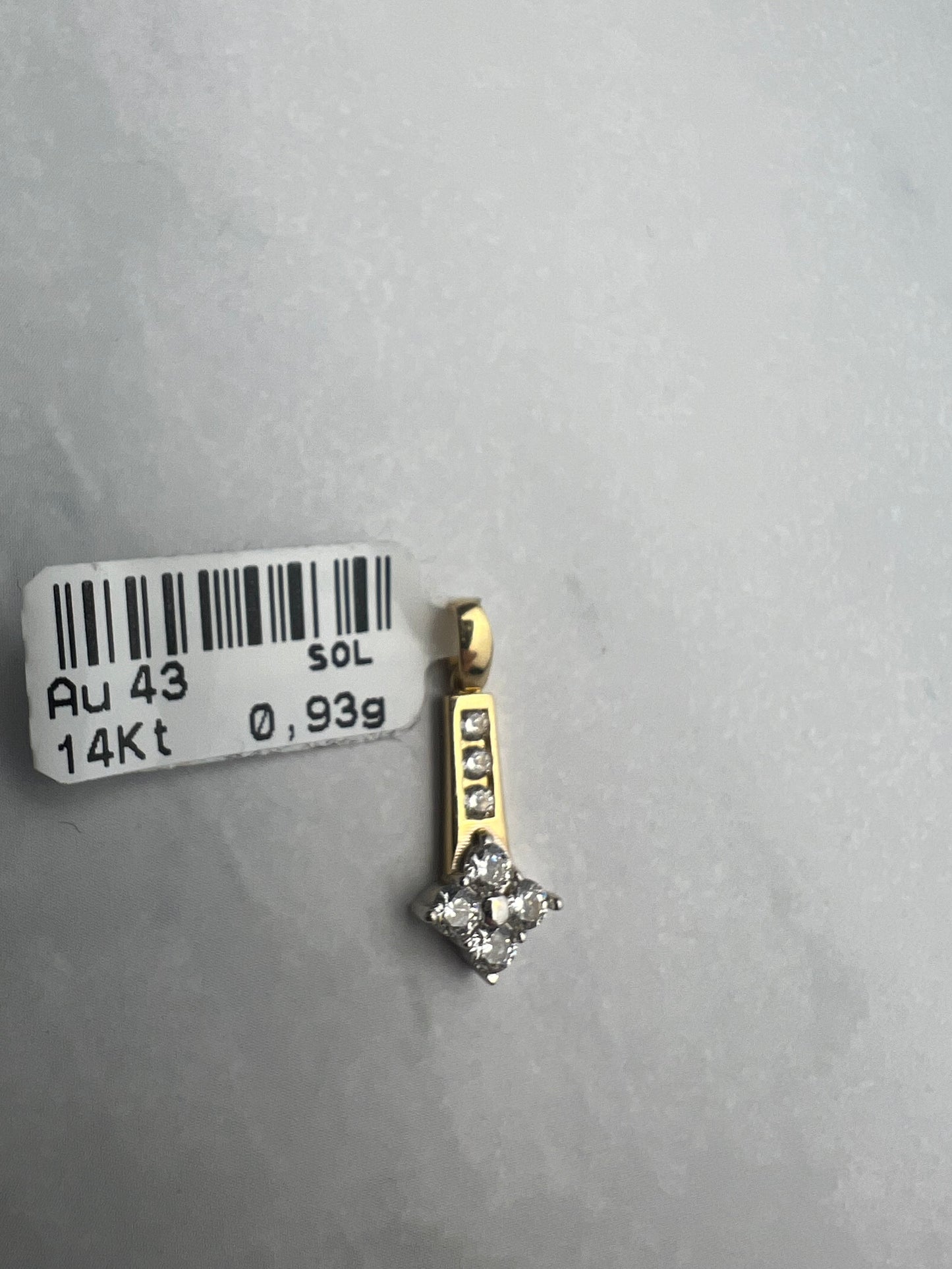 Extra modern fazonú arany medál fehér cirkónia kövekkel díszítve