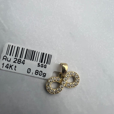 Végtelen formájú arany medál fehér cirkónia kövekkel díszítve