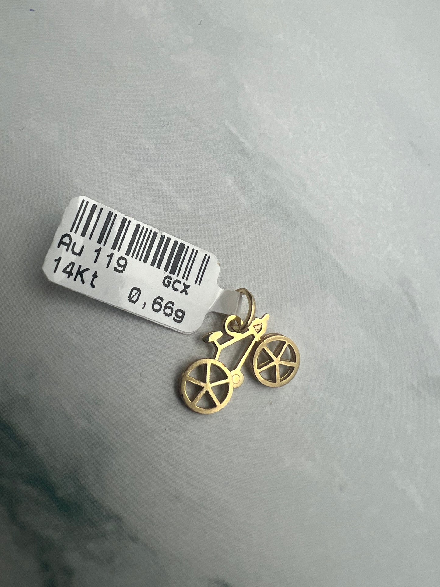 Bicikli alakú arany medál