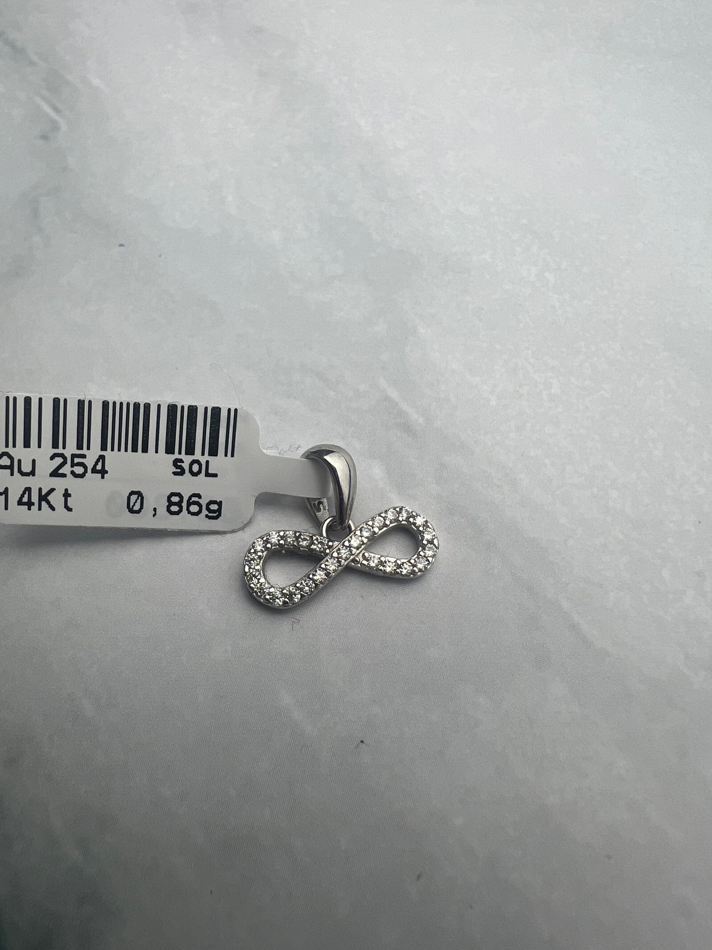 Végtelen fehérarany medál