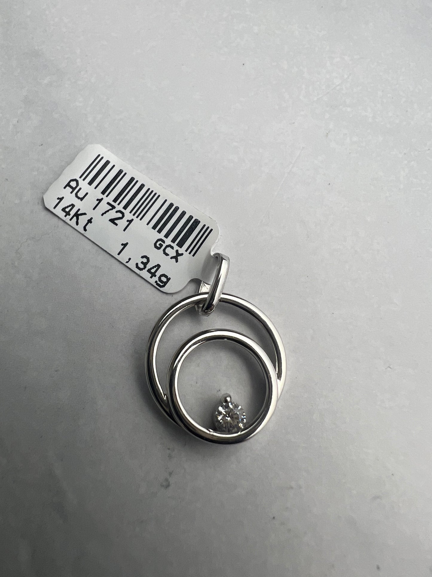 Dupla kör alakú medál, belül cirkónia kővel