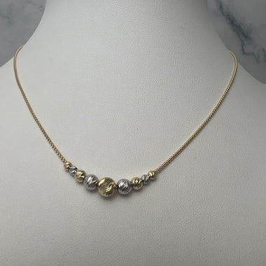 Bicolor metszett gömbös arany nyaklánc