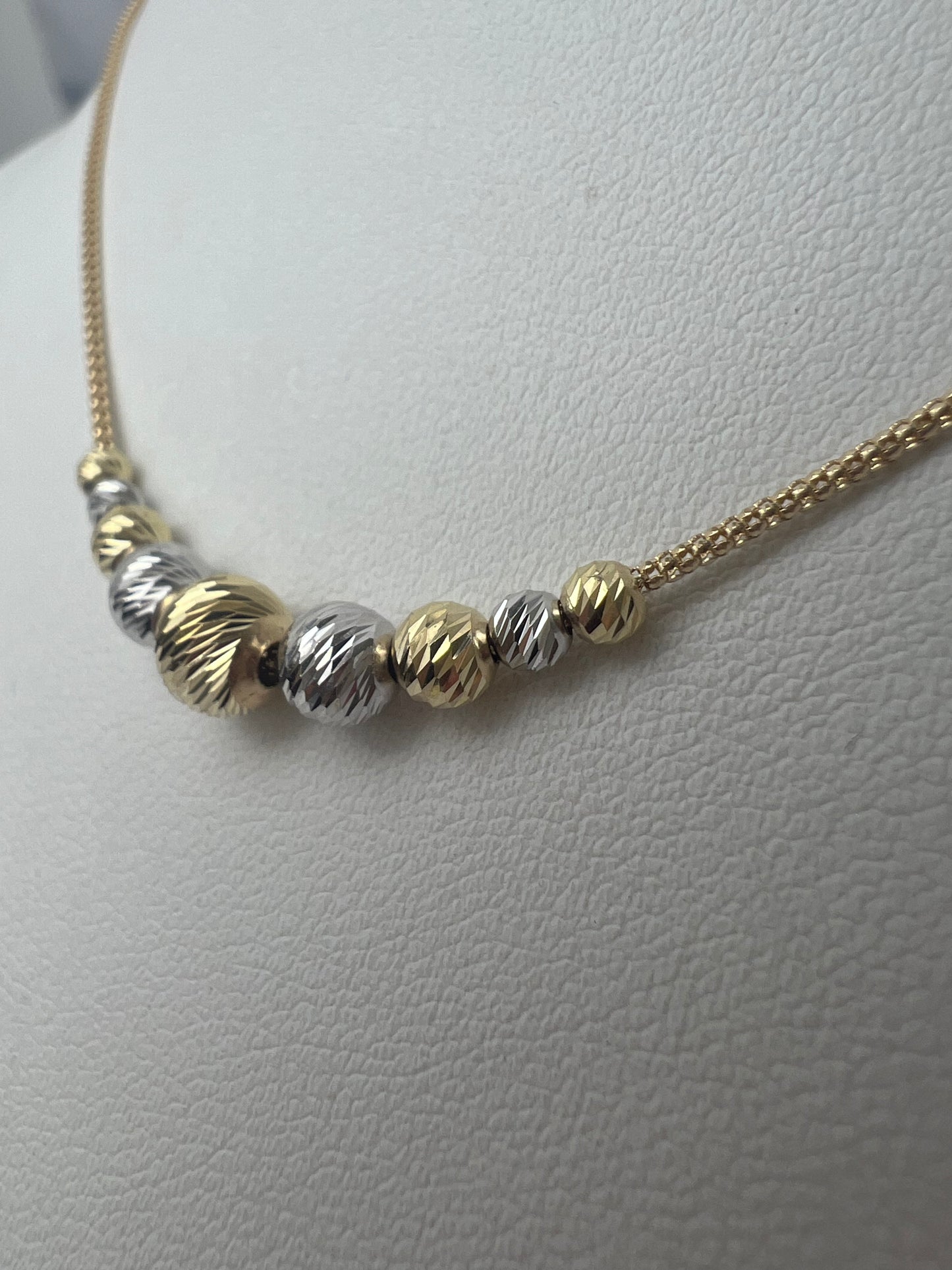 Bicolor metszett gömbös arany nyaklánc