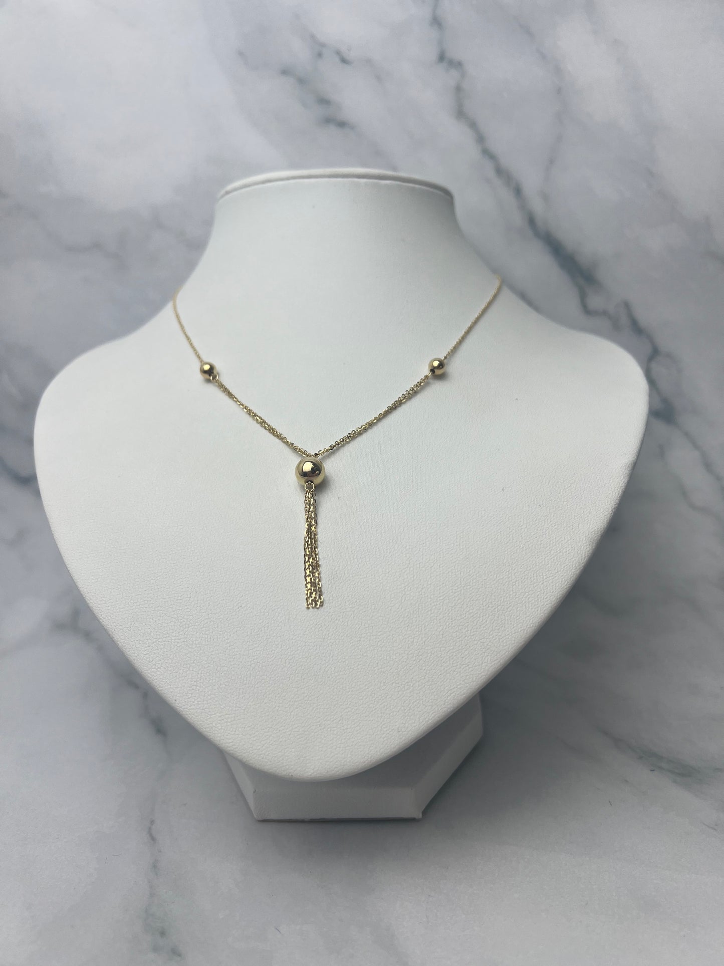 Gömbökkel díszített csüngős arany nyaklánc