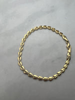 Háromszög szemes fűzött fazonú arany karlánc